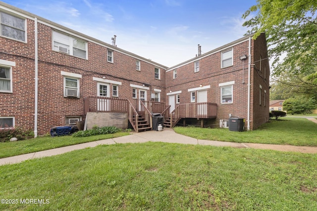 317 Bath Ave Unit 2, Long Branch, NJ 07740 - rear view of house featuring central AC, a yard, and brick siding