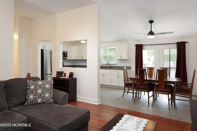1117 Ruby Dr, Toms River, NJ 08753 - living area featuring light wood-style floors, ceiling fan, and baseboards