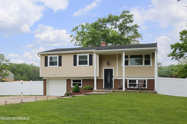 1117 Ruby Dr, Toms River, NJ 08753 - bi-level home featuring concrete driveway, brick siding, an attached garage, and a chimney