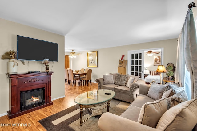 846 Winchester Ct Unit A, Manchester, NJ 08759 - living area featuring ceiling fan, light wood-style floors, and a lit fireplace
