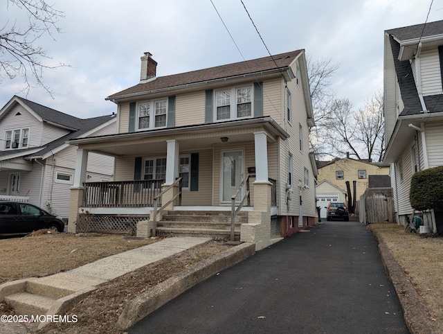 619 Leland Ave, Plainfield, NJ 07062 - traditional style home featuring a chimney, a porch, and a detached garage