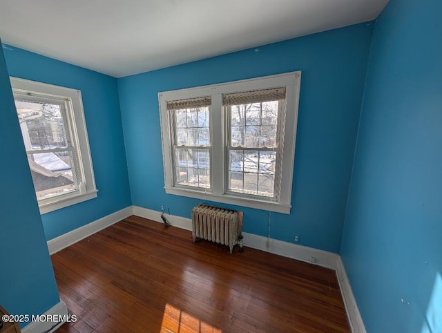 619 Leland Ave, Plainfield, NJ 07062 - empty room featuring radiator, healthy amount of natural light, hardwood / wood-style floors, and baseboards