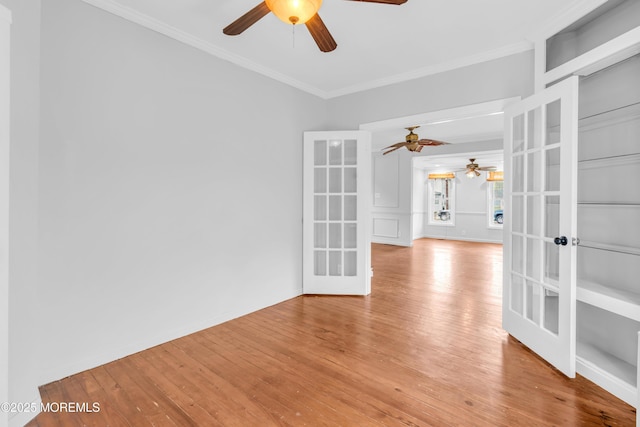 208 Cedar St, Lakehurst, NJ 08733 - unfurnished room with a ceiling fan, french doors, ornamental molding, light wood-style floors, and baseboards