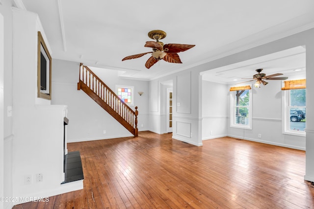 208 Cedar St, Lakehurst, NJ 08733 - unfurnished living room featuring ceiling fan, stairway, hardwood / wood-style flooring, baseboards, and ornamental molding
