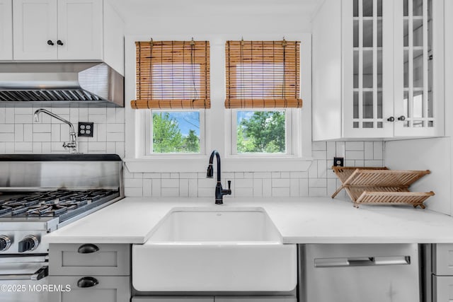 208 Cedar St, Lakehurst, NJ 08733 - kitchen with a sink, wall chimney exhaust hood, tasteful backsplash, glass insert cabinets, and light stone countertops