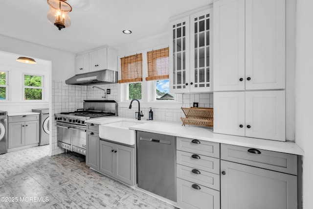 208 Cedar St, Lakehurst, NJ 08733 - kitchen with stainless steel appliances, under cabinet range hood, a sink, gray cabinets, and healthy amount of natural light