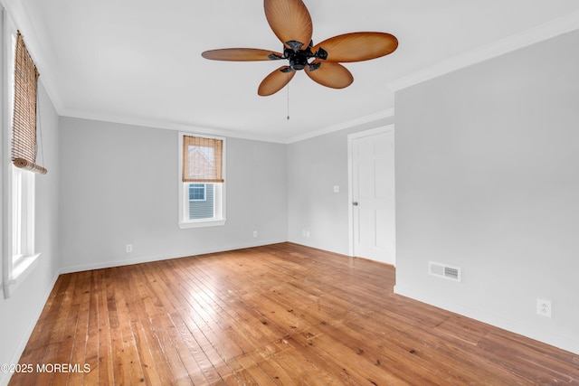 208 Cedar St, Lakehurst, NJ 08733 - spare room featuring a ceiling fan, ornamental molding, wood-type flooring, and baseboards