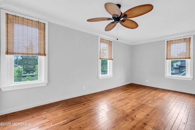 208 Cedar St, Lakehurst, NJ 08733 - unfurnished room with hardwood / wood-style flooring, baseboards, ceiling fan, and ornamental molding