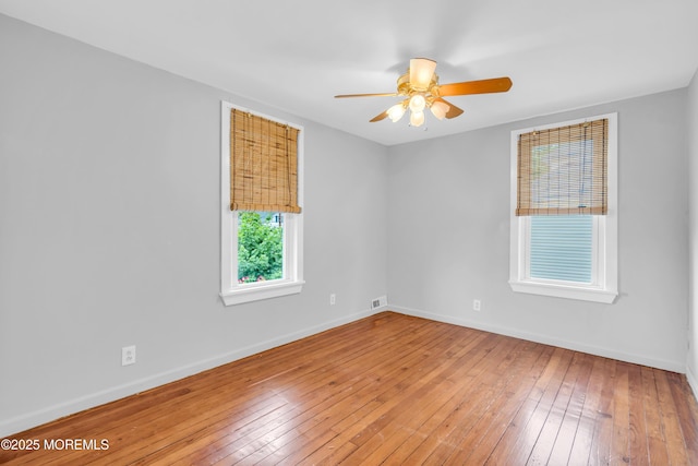208 Cedar St, Lakehurst, NJ 08733 - unfurnished room with wood-type flooring, a ceiling fan, and baseboards