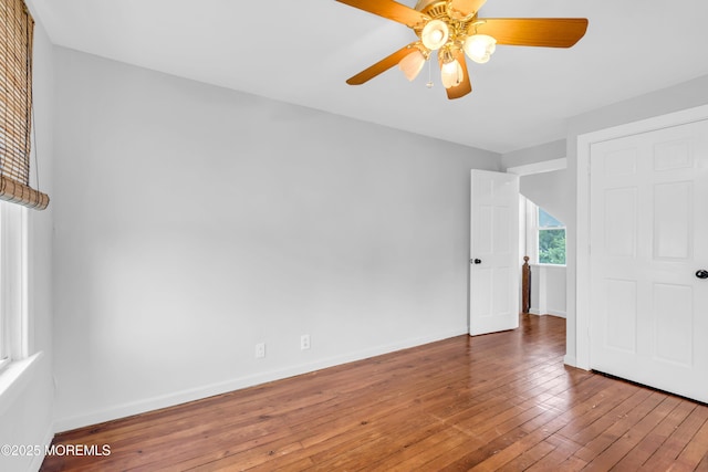 208 Cedar St, Lakehurst, NJ 08733 - unfurnished bedroom with hardwood / wood-style flooring, baseboards, and ceiling fan