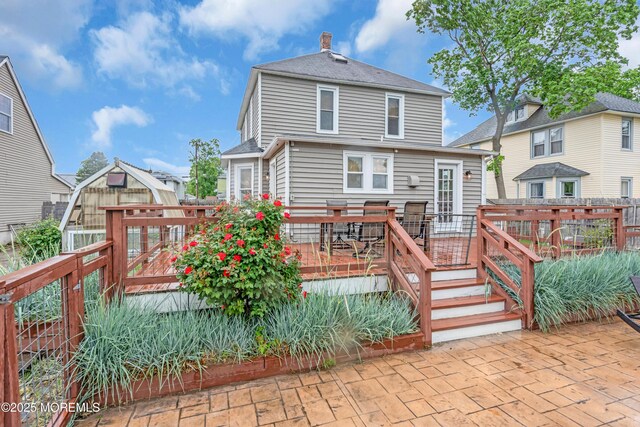 208 Cedar St, Lakehurst, NJ 08733 - back of property with a deck and a patio