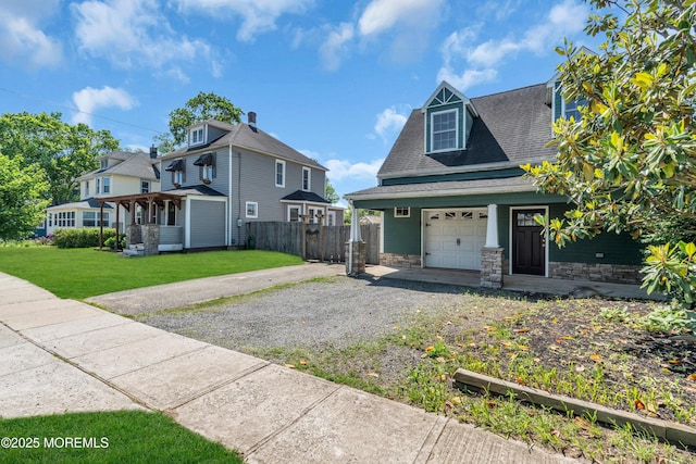 208 Cedar St, Lakehurst, NJ 08733 - view of front of home with driveway, a shingled roof, and stone siding