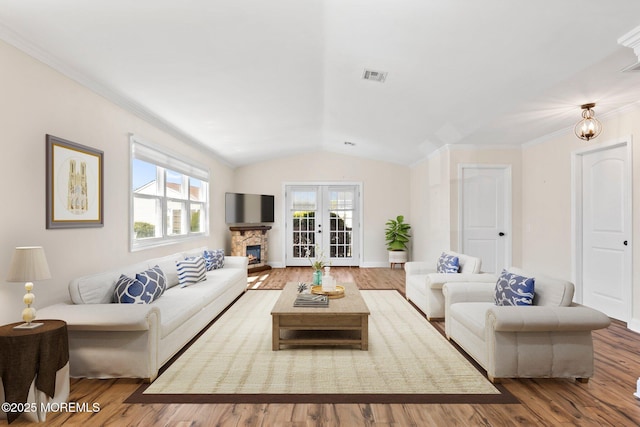 40 Prince Charles Dr, Toms River, NJ 08757 - living area featuring vaulted ceiling, wood finished floors, a fireplace, and ornamental molding