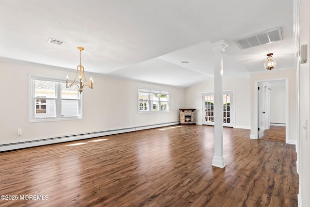 40 Prince Charles Dr, Toms River, NJ 08757 - unfurnished living room with a chandelier, dark wood finished floors, baseboard heating, vaulted ceiling, and baseboards