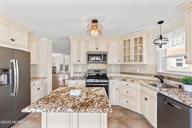 40 Prince Charles Dr, Toms River, NJ 08757 - kitchen with stainless steel appliances, cream cabinets, and light stone countertops