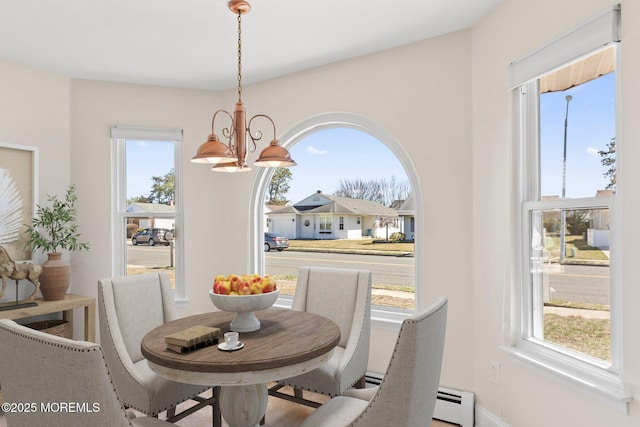 40 Prince Charles Dr, Toms River, NJ 08757 - dining space with a chandelier, baseboards, and a baseboard heating unit