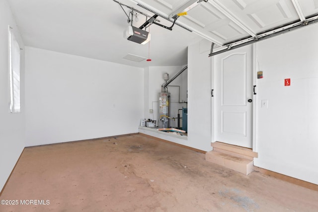 40 Prince Charles Dr, Toms River, NJ 08757 - garage featuring gas water heater and a garage door opener