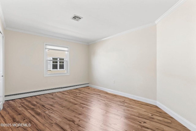 40 Prince Charles Dr, Toms River, NJ 08757 - unfurnished room with a baseboard heating unit, crown molding, wood finished floors, and baseboards