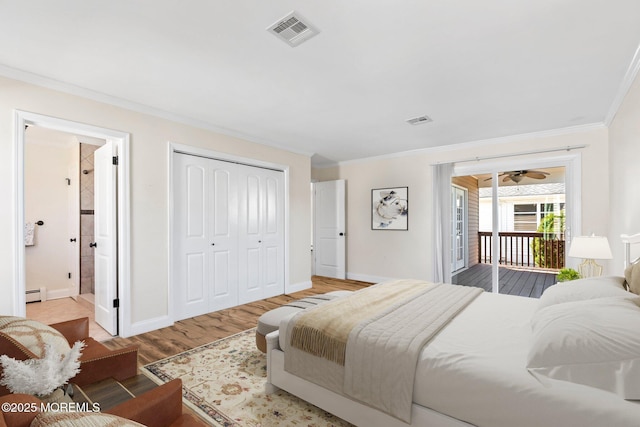 40 Prince Charles Dr, Toms River, NJ 08757 - bedroom featuring crown molding, access to outside, a baseboard radiator, wood finished floors, and baseboards