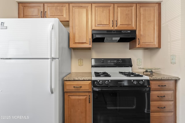 6 Rumford Ct, Jackson, NJ 08527 - kitchen with freestanding refrigerator, gas range, under cabinet range hood, and light stone countertops