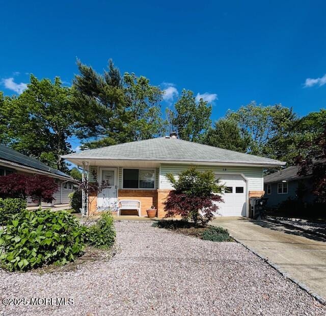 15 Mount Logan Ln, Toms River, NJ 08753 - view of front of home featuring an attached garage, concrete driveway, and brick siding