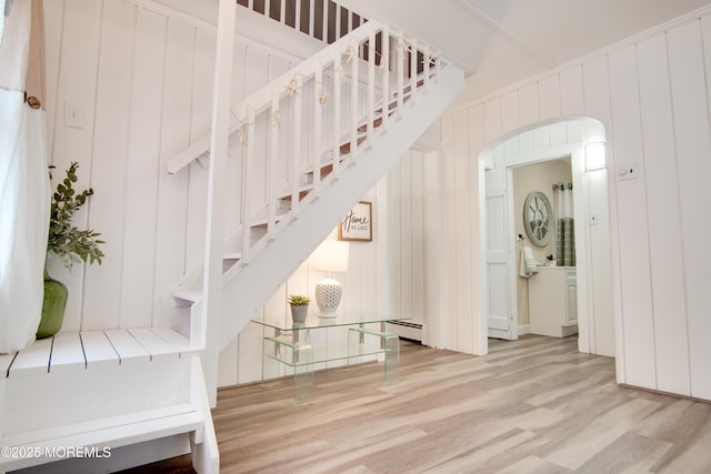 112 Bash Rd, Toms River, NJ 08753 - stairs featuring wood finished floors, arched walkways, and baseboard heating