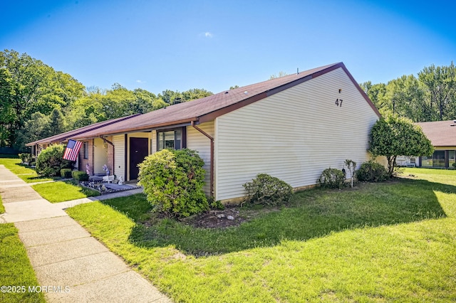 47 Wild Turkey Way Unit E, Manalapan, NJ 07726 - view of side of property featuring a lawn