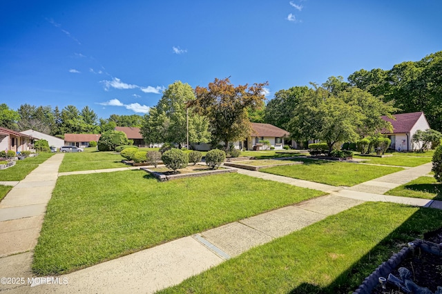 47 Wild Turkey Way Unit E, Manalapan, NJ 07726 - view of front facade with a front lawn and a residential view