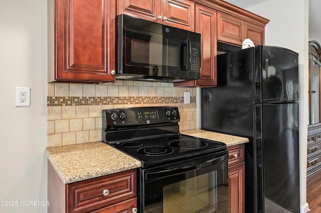 47 Wild Turkey Way Unit E, Manalapan, NJ 07726 - kitchen with black appliances, backsplash, light stone counters, and dark brown cabinets