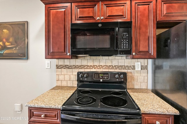 47 Wild Turkey Way Unit E, Manalapan, NJ 07726 - kitchen featuring black appliances, reddish brown cabinets, backsplash, and light stone counters