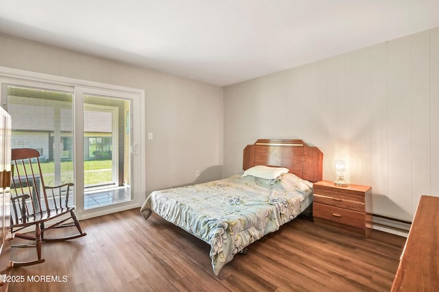 47 Wild Turkey Way Unit E, Manalapan, NJ 07726 - bedroom with wood finished floors, a baseboard heating unit, and access to exterior