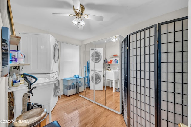773 Princeton Ave, Brick, NJ 08724 - laundry area with stacked washer and clothes dryer, a ceiling fan, and light wood-style floors