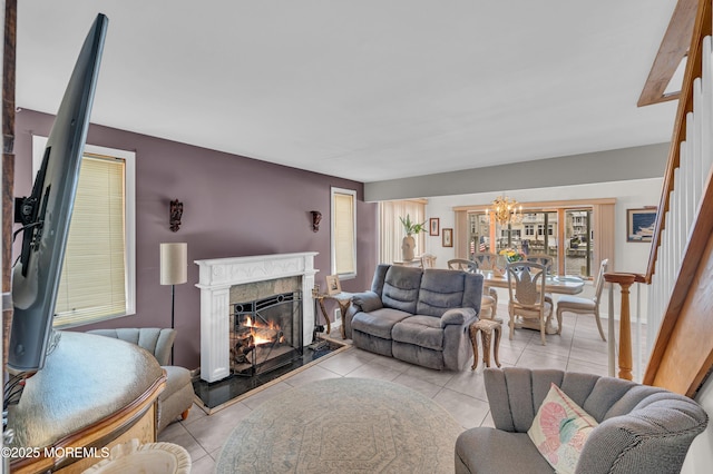 773 Princeton Ave, Brick, NJ 08724 - living area featuring stairway, a chandelier, tile patterned flooring, and a premium fireplace