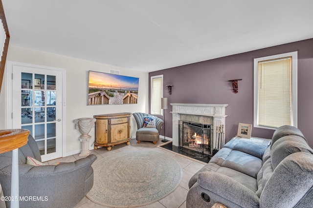 773 Princeton Ave, Brick, NJ 08724 - living area featuring a high end fireplace, tile patterned floors, and baseboards