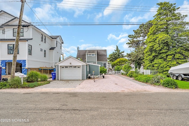 773 Princeton Ave, Brick, NJ 08724 - view of front facade featuring driveway, a detached garage, and an outbuilding