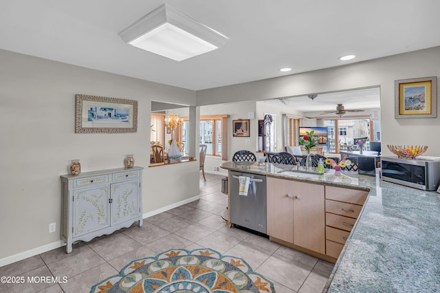 773 Princeton Ave, Brick, NJ 08724 - kitchen featuring appliances with stainless steel finishes, a peninsula, light tile patterned flooring, a ceiling fan, and baseboards