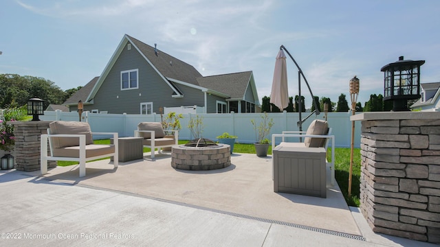 24 Woodview Ln, Cape May Court House, NJ 08210 - view of patio featuring an outdoor fire pit