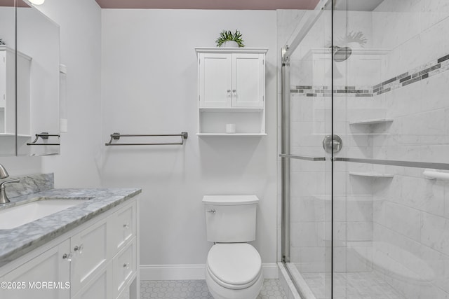 24 Woodview Ln, Cape May Court House, NJ 08210 - bathroom featuring vanity, a shower stall, toilet, tile patterned flooring, and baseboards