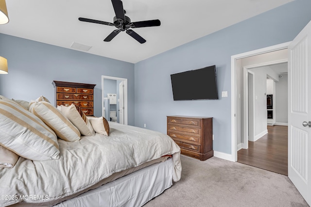 24 Woodview Ln, Cape May Court House, NJ 08210 - carpeted bedroom with ensuite bath, a ceiling fan, and baseboards