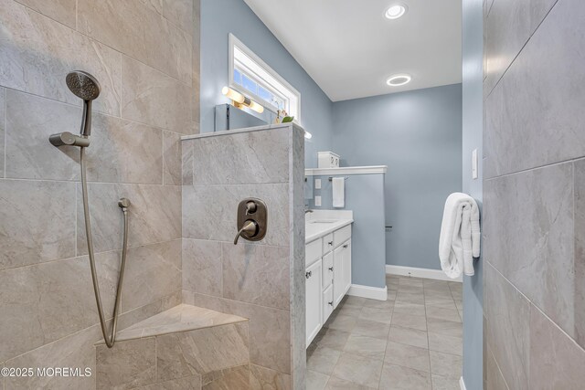 24 Woodview Ln, Cape May Court House, NJ 08210 - bathroom featuring tiled shower, vanity, and baseboards