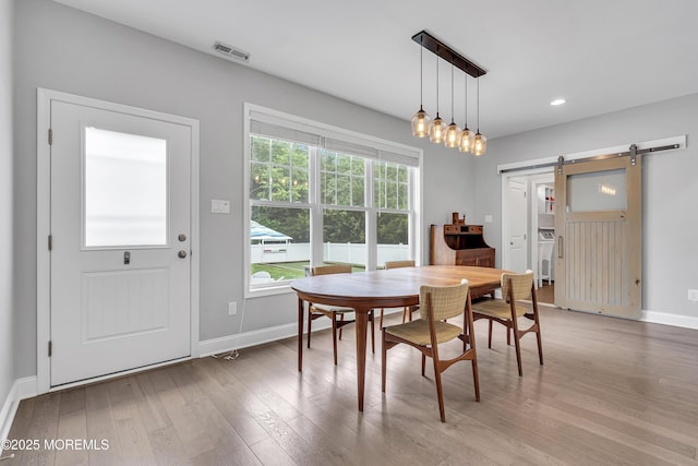 24 Woodview Ln, Cape May Court House, NJ 08210 - dining space featuring a barn door, light wood finished floors, baseboards, and recessed lighting