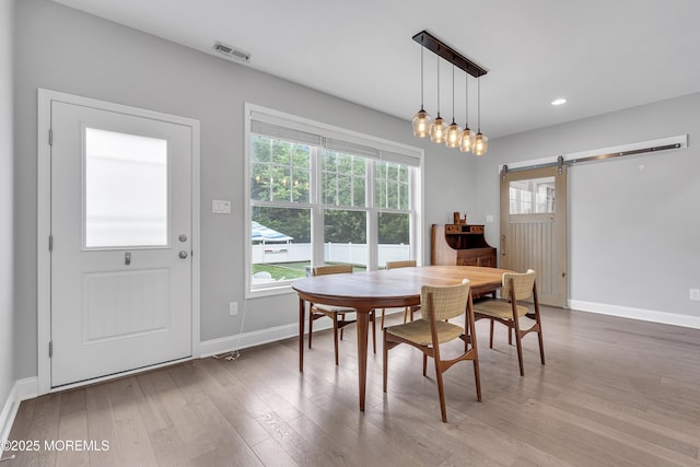 24 Woodview Ln, Cape May Court House, NJ 08210 - dining room with a barn door, wood finished floors, baseboards, and recessed lighting