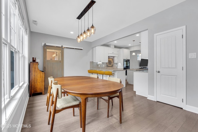 24 Woodview Ln, Cape May Court House, NJ 08210 - dining space with a barn door, plenty of natural light, wood finished floors, baseboards, and recessed lighting