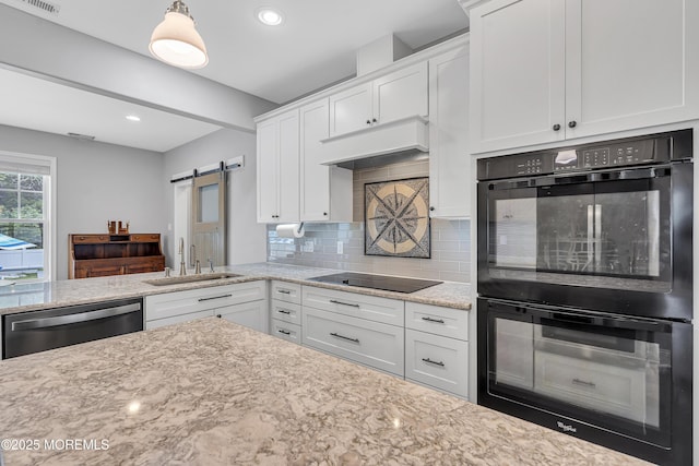 24 Woodview Ln, Cape May Court House, NJ 08210 - kitchen with black appliances, a sink, tasteful backsplash, white cabinets, and light stone countertops