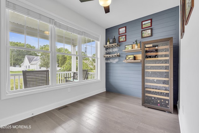 24 Woodview Ln, Cape May Court House, NJ 08210 - indoor dry bar with baseboards, a ceiling fan, wood finished floors, and wood walls