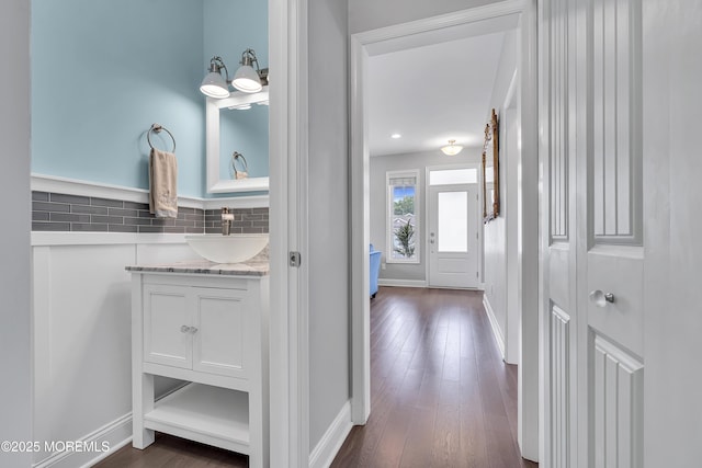24 Woodview Ln, Cape May Court House, NJ 08210 - corridor featuring a sink, baseboards, and dark wood finished floors