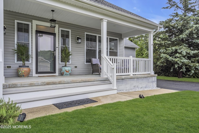 24 Woodview Ln, Cape May Court House, NJ 08210 - doorway to property with a porch and a lawn