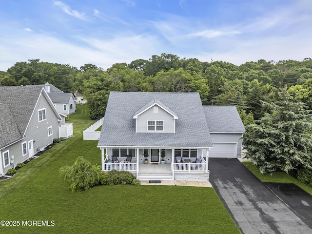 24 Woodview Ln, Cape May Court House, NJ 08210 - view of front facade featuring a porch, a front lawn, driveway, a shingled roof, and a garage