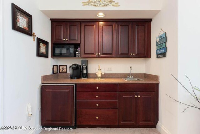 700 Ocean Ave Unit 514, Spring Lake, NJ 07762 - indoor wet bar with black microwave and baseboards
