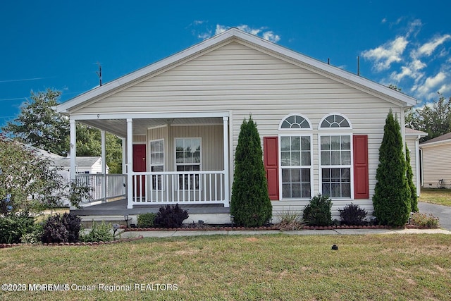 9 Pine Grove Ave, Manahawkin, NJ 08050 - view of front facade featuring a porch and a front yard